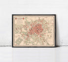 The image is a framed vintage map of a city, likely from the 19th century, with a detailed layout of streets, buildings, and other landmarks.