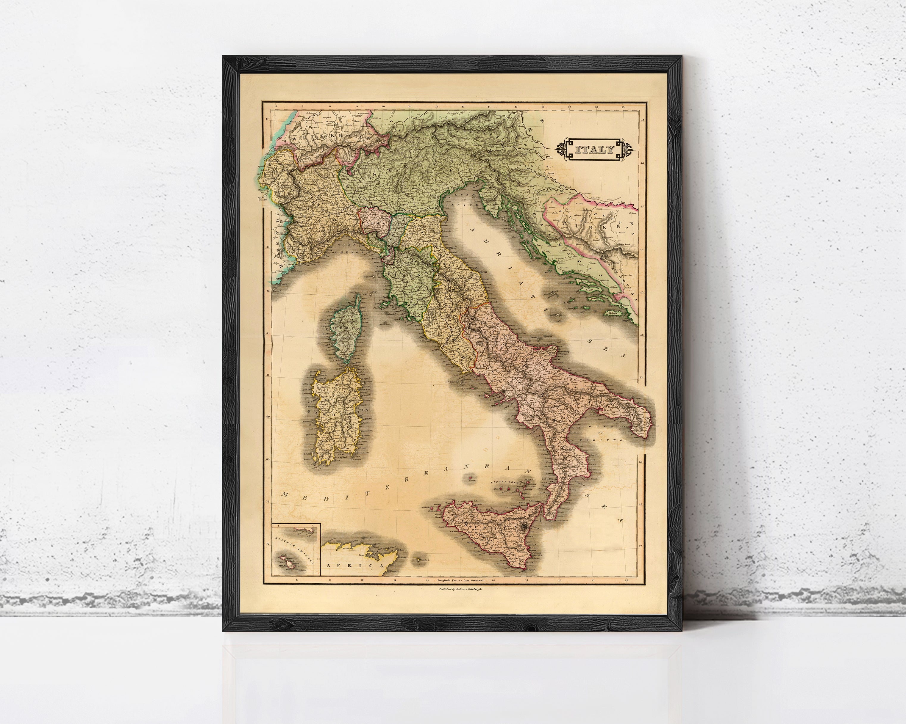 The image is a framed vintage map of Italy, depicting the country's geographical layout and surrounding areas.