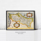 The image is a framed antique map of a region, likely from the 16th century, with intricate details and decorative elements.