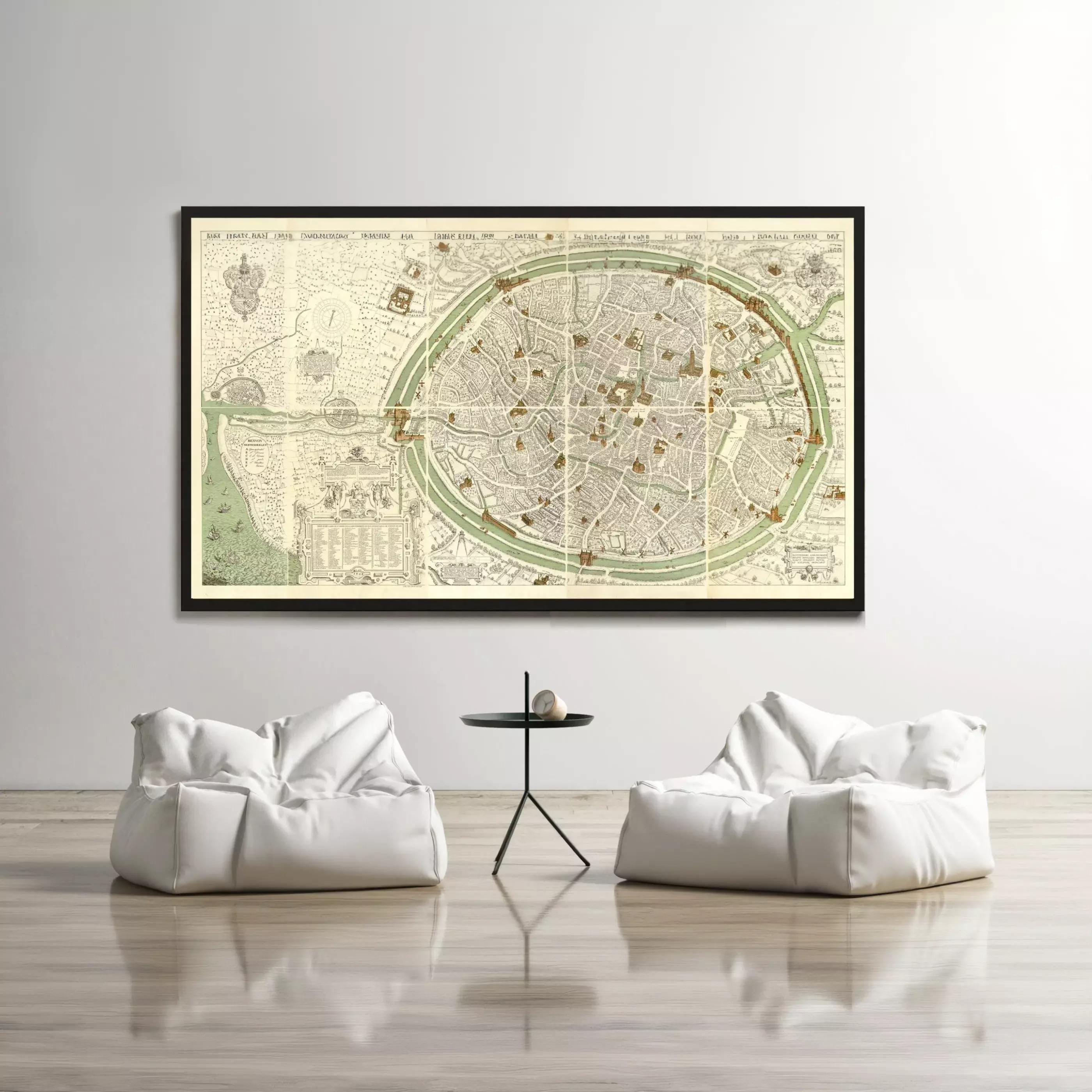 a large framed map of a city displayed on a wall, with two white bean bag chairs positioned in front of it.