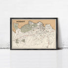 The image is a framed map of Hobart, Australia, showing the city's streets, landmarks, and surrounding areas.