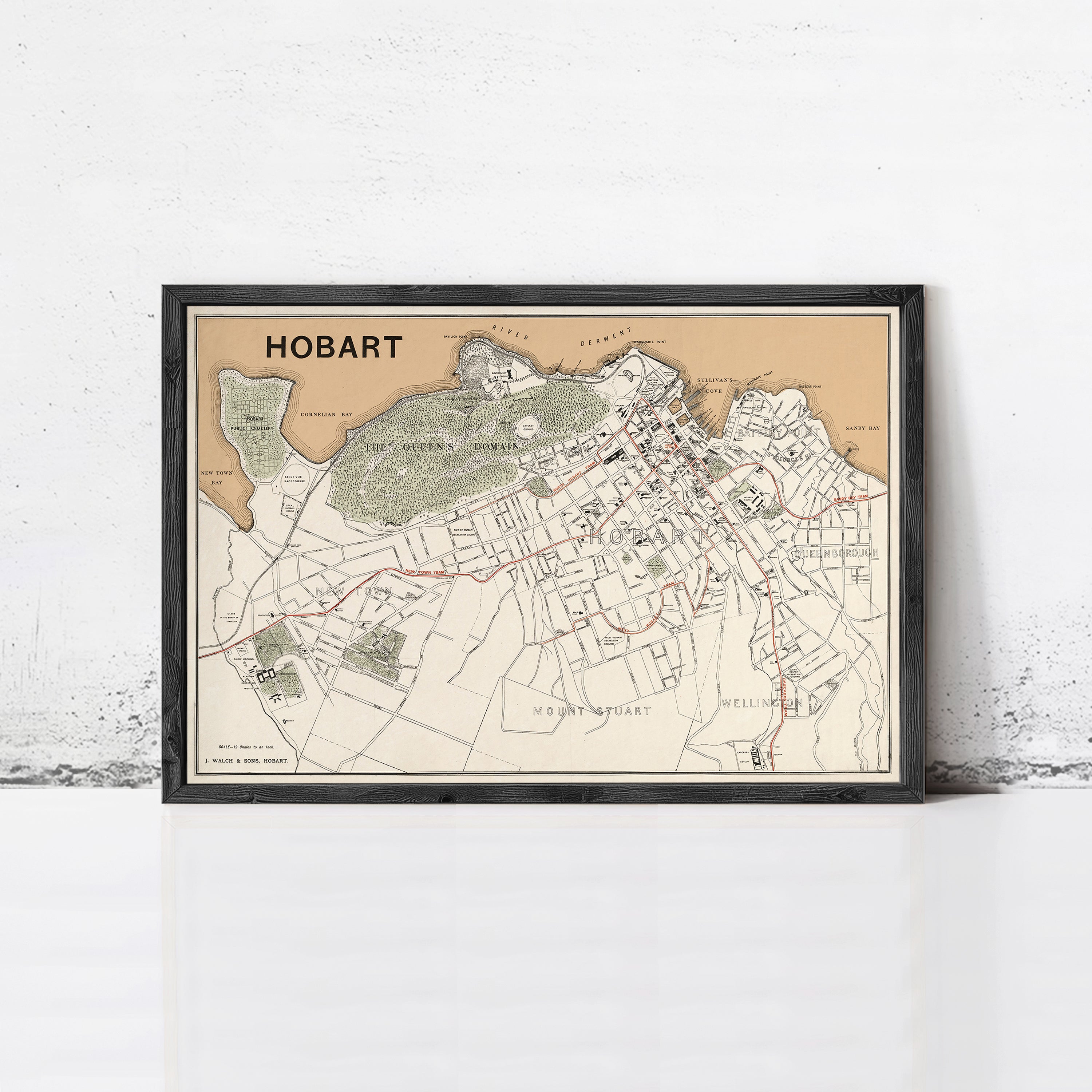 The image is a framed map of Hobart, Australia, showing the city's streets, landmarks, and surrounding areas.