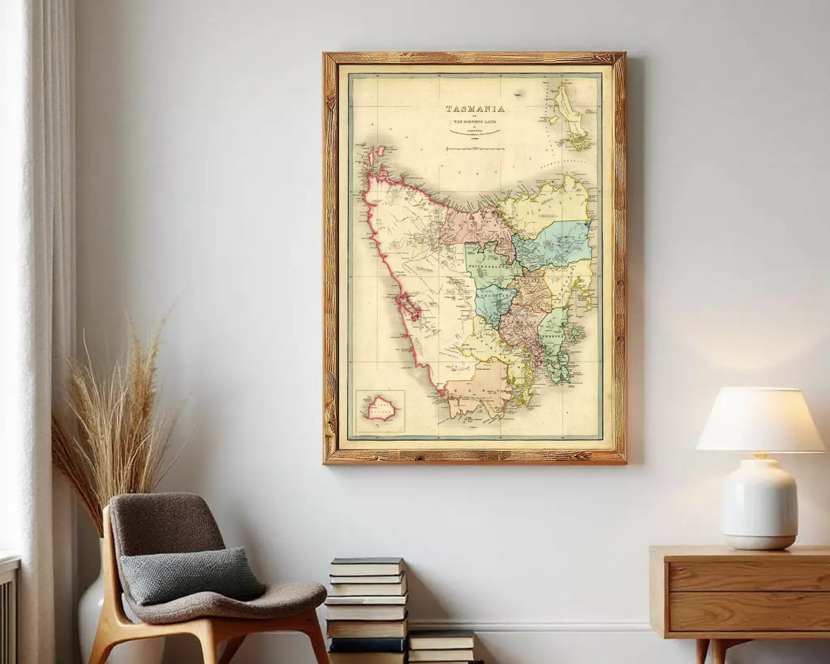 The image is a framed vintage map of Tasmania, Australia, depicting the state's geographical layout and boundaries.