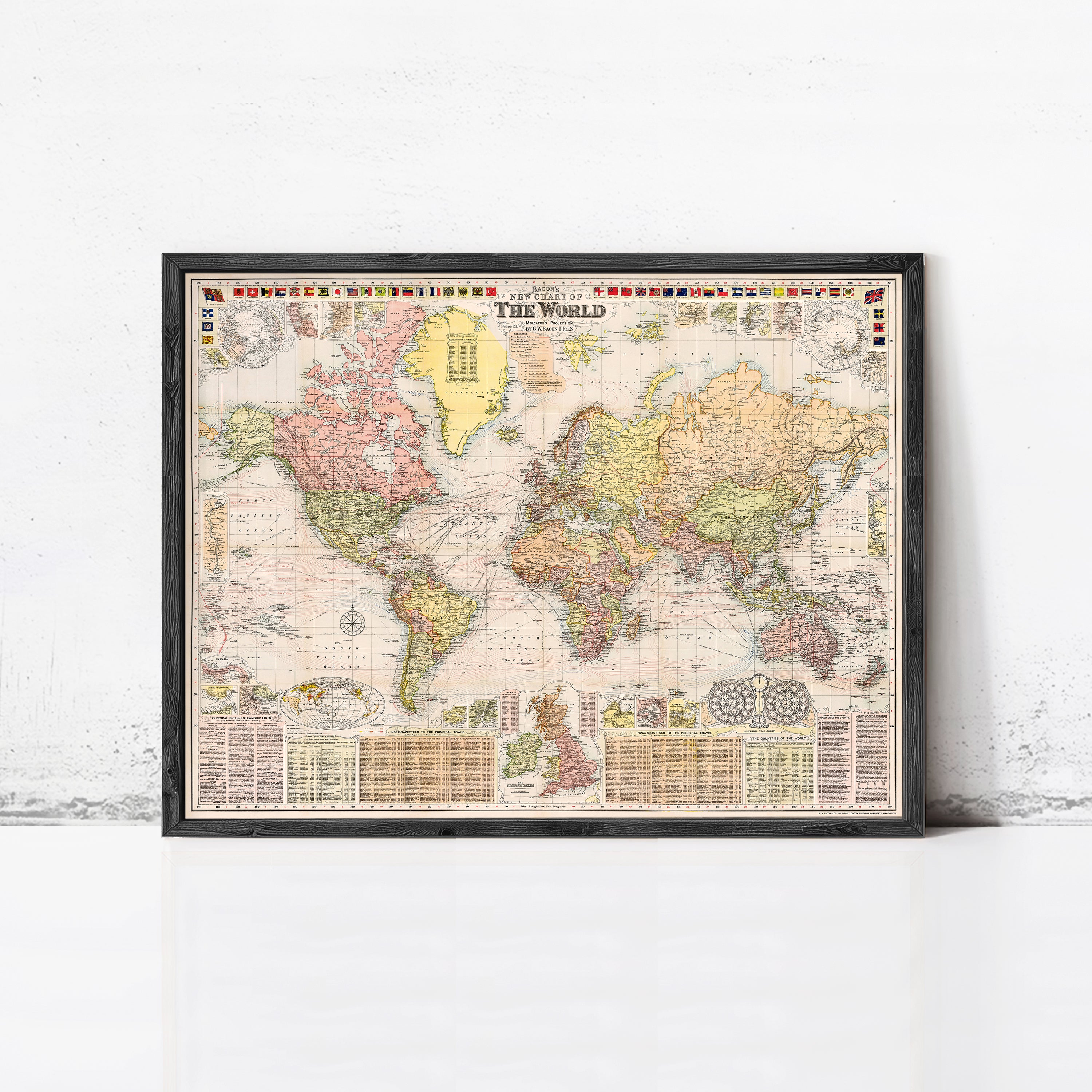 The image is a framed vintage world map with colorful borders and detailed labels.