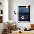 a cozy living room with a large framed artwork of a nighttime landscape featuring a tree and glowing figures, hanging on the wall. The room is furnished with a white chair, a lamp, and a wooden dresser, creating a warm and inviting atmosphere.
