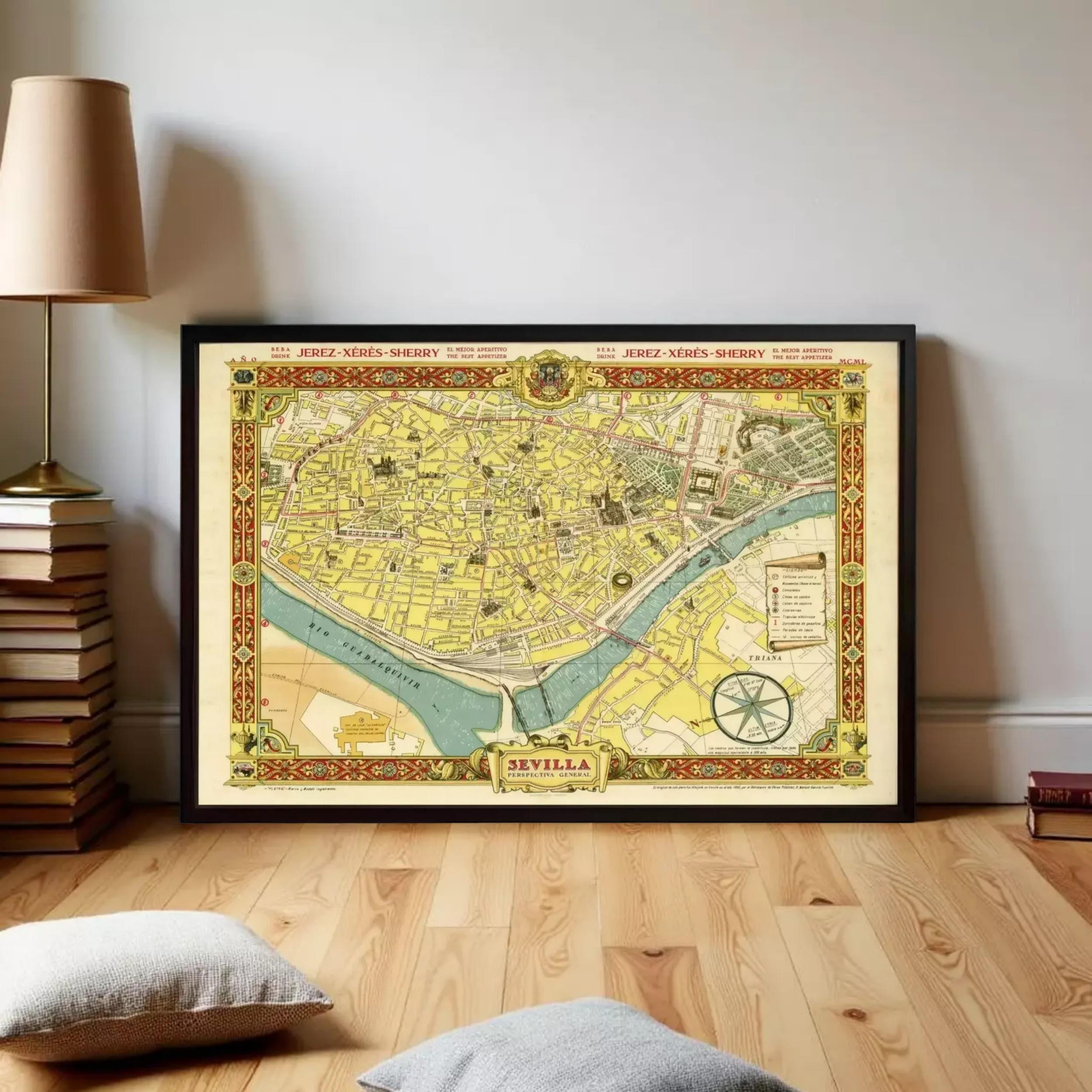 a framed map of the city of Seville, Spain, displayed on a wooden floor in a room with a lamp and books.