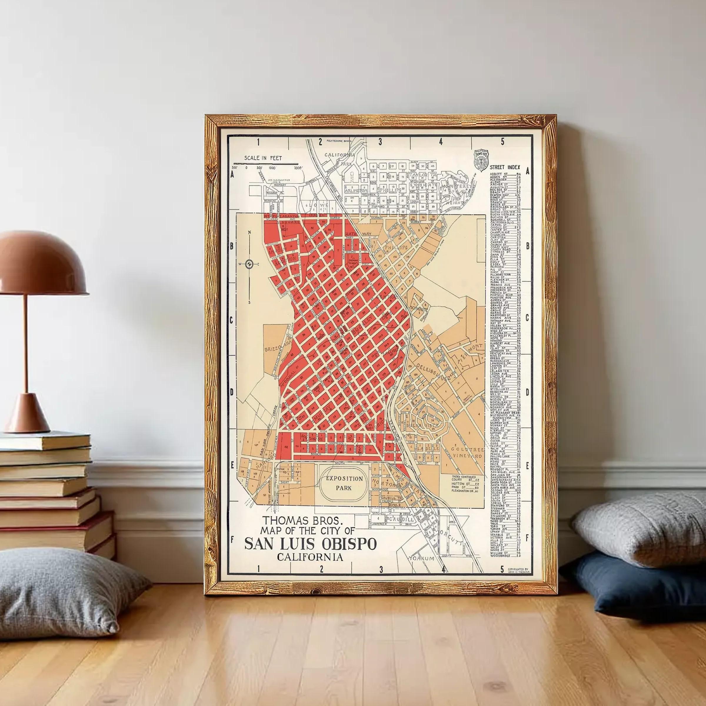 The image is a framed vintage map of San Luis Obispo, California, depicting a detailed street layout and surrounding areas.