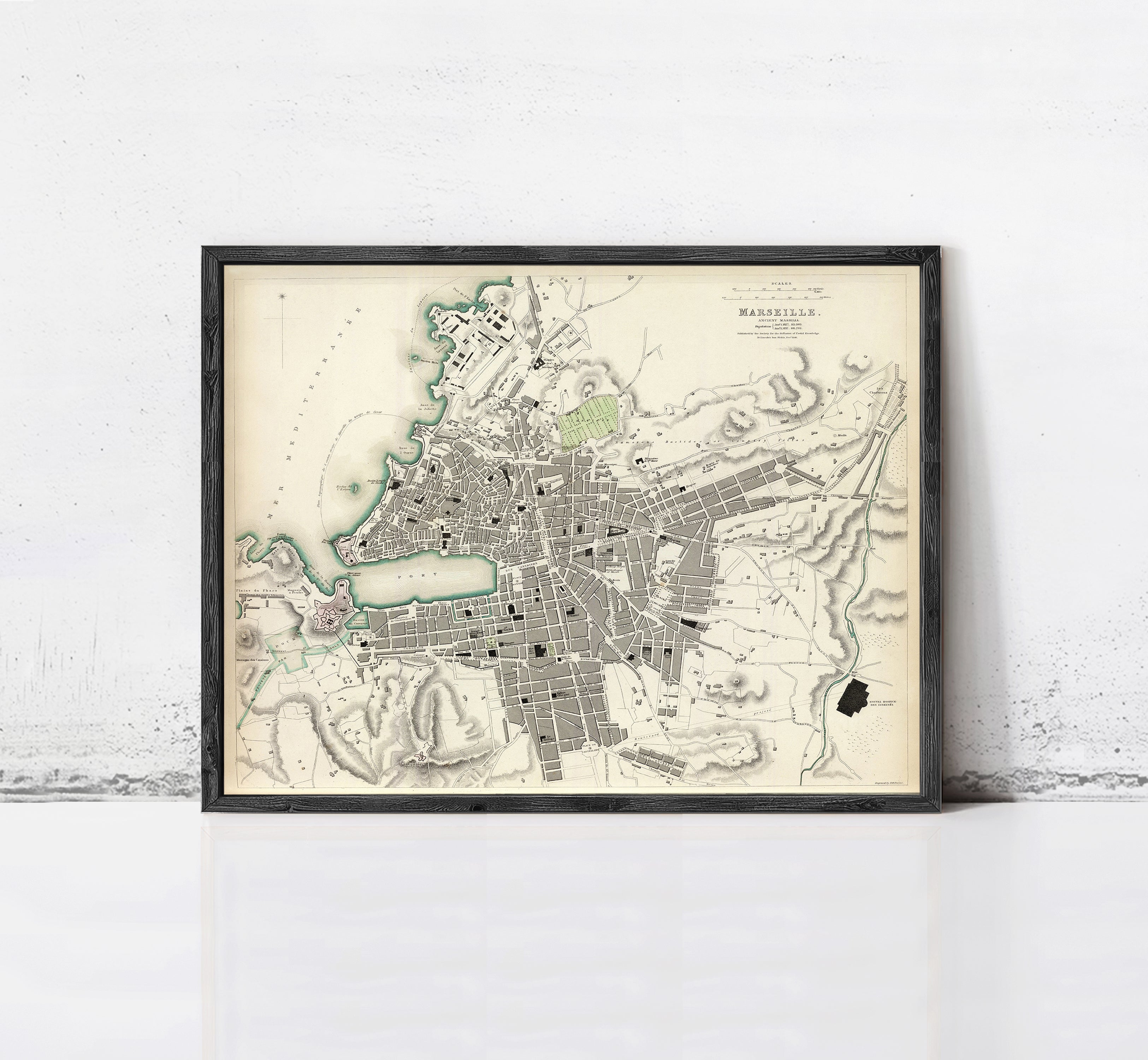 The image is a framed vintage map of a city, likely from the 19th century, depicting the layout and geographical features of the area.