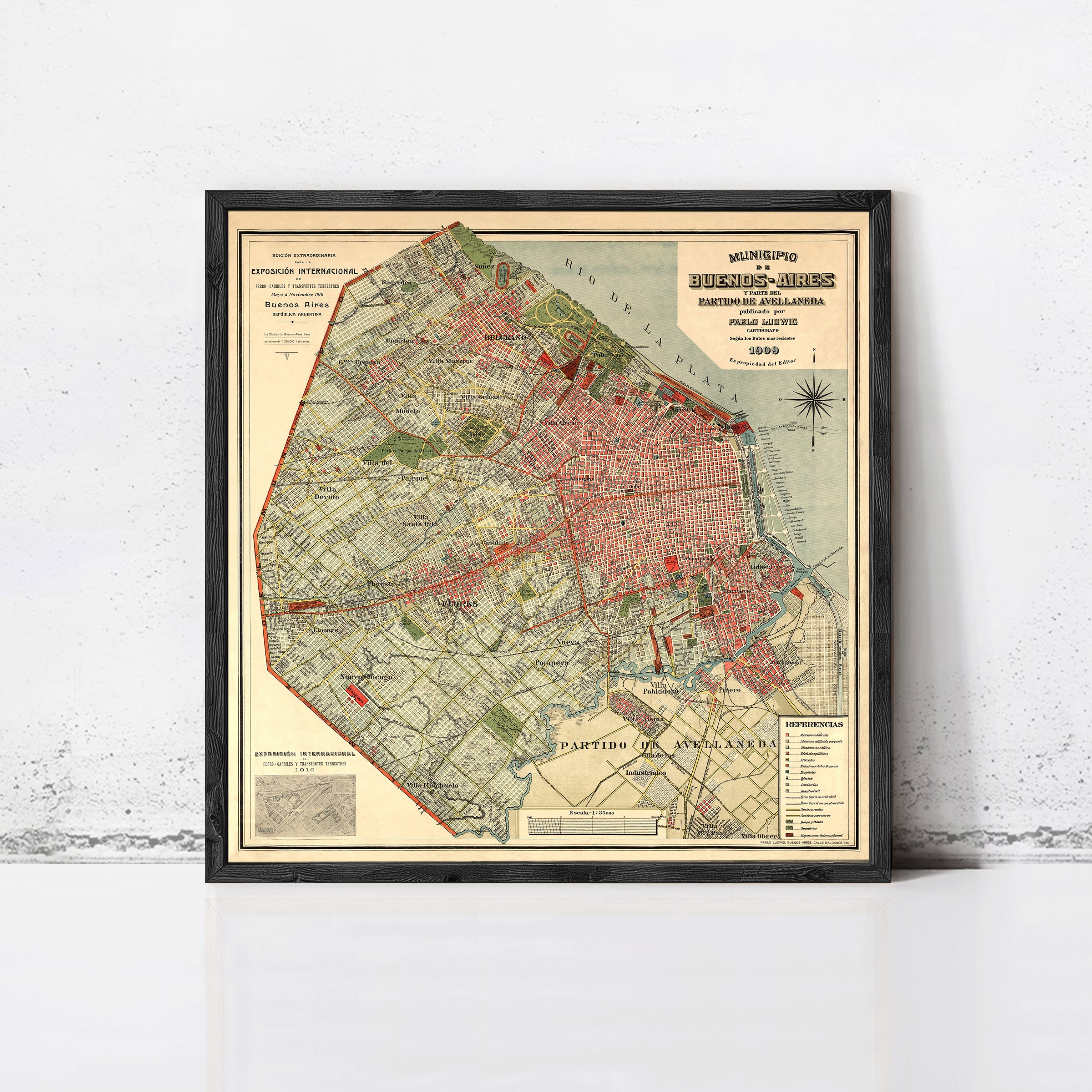 The image is a framed vintage map of Buenos Aires, Argentina, depicting the city's streets, neighborhoods, and surrounding areas.