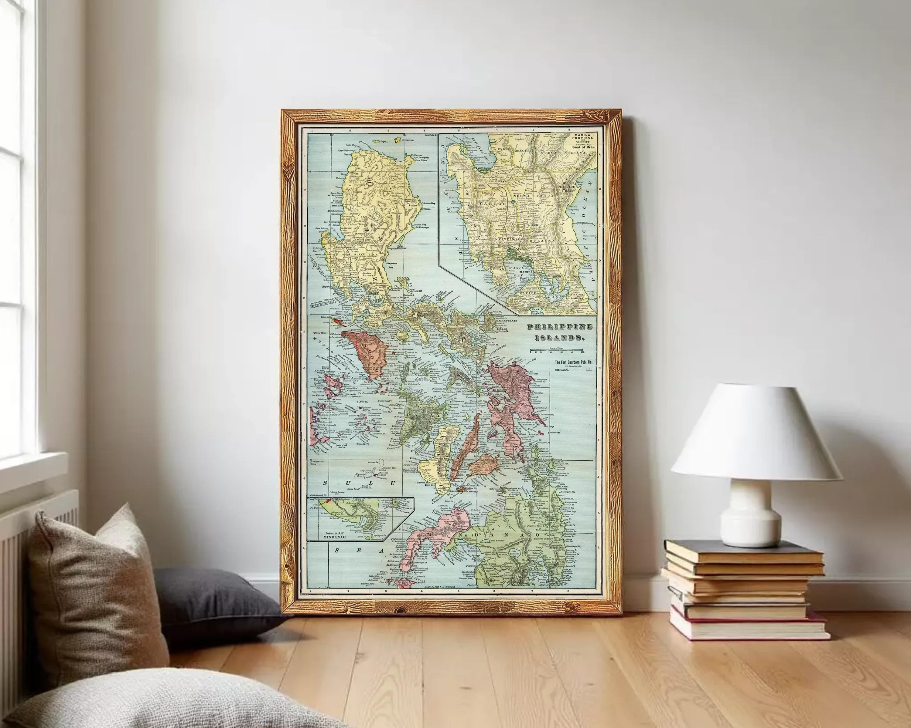The image is a framed vintage map of the Philippines, showing the country's geographical layout and surrounding areas.