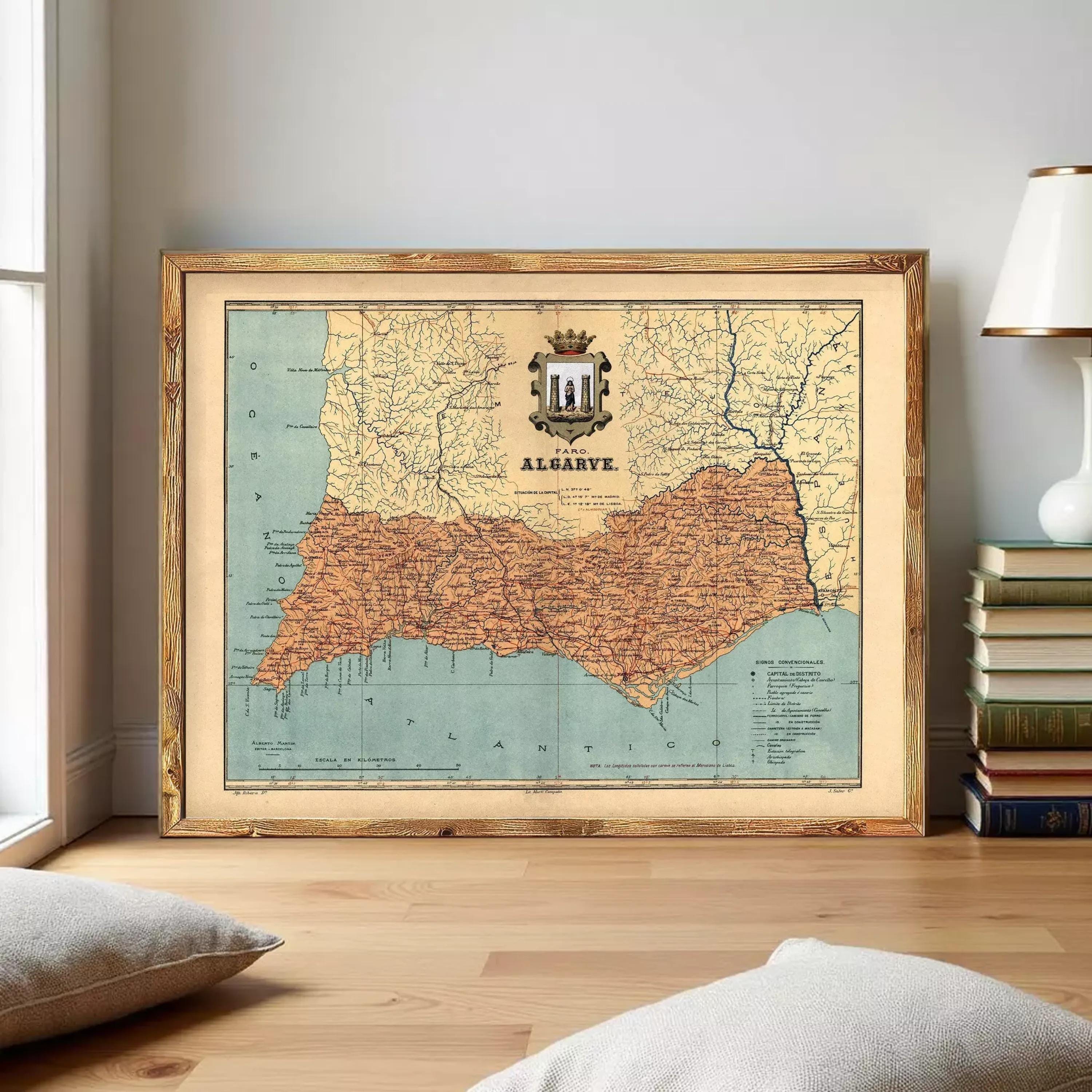 a framed map of Algarve, a region in Portugal, with a coat of arms prominently displayed on the map.