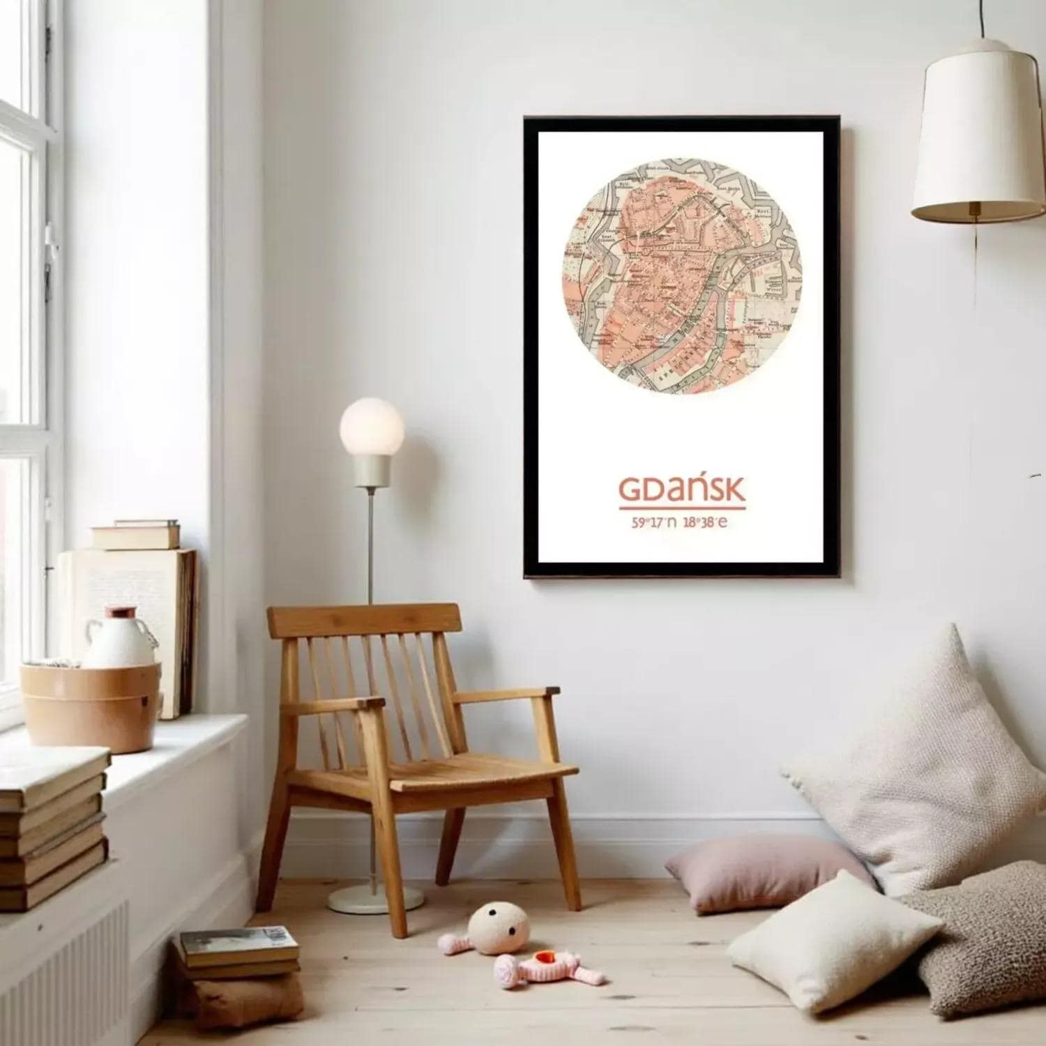 a cozy living room with a wooden chair, a lamp, and a framed map of Gdansk, Poland, hanging on the wall.