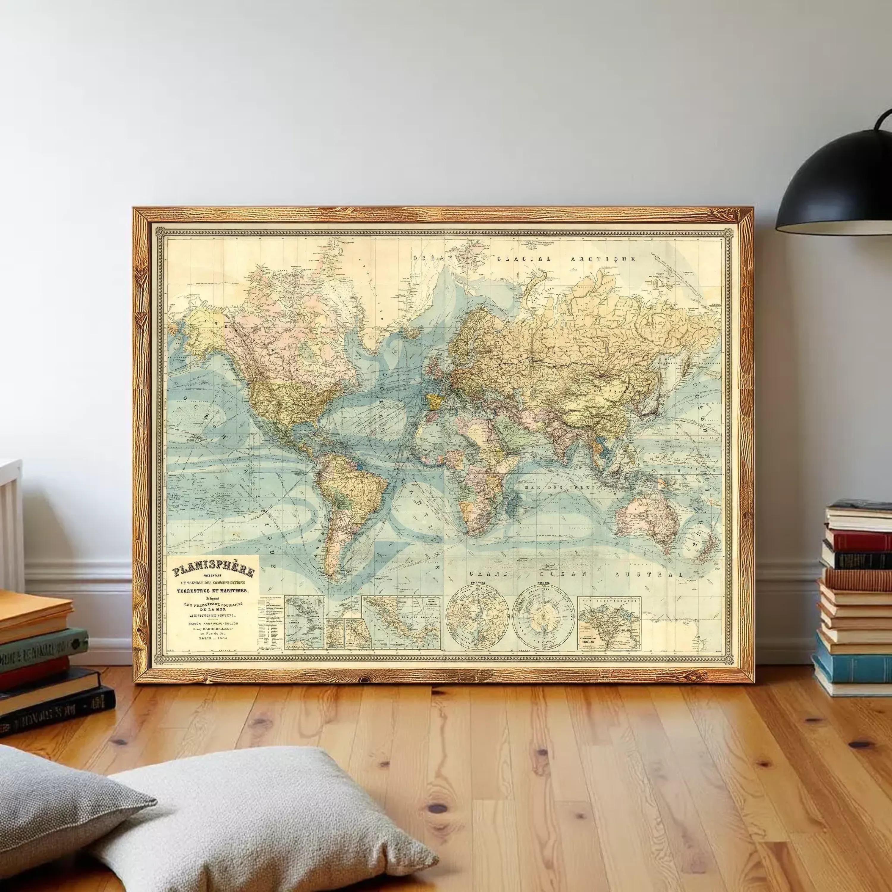 a large, framed world map hanging on a wall in a room.