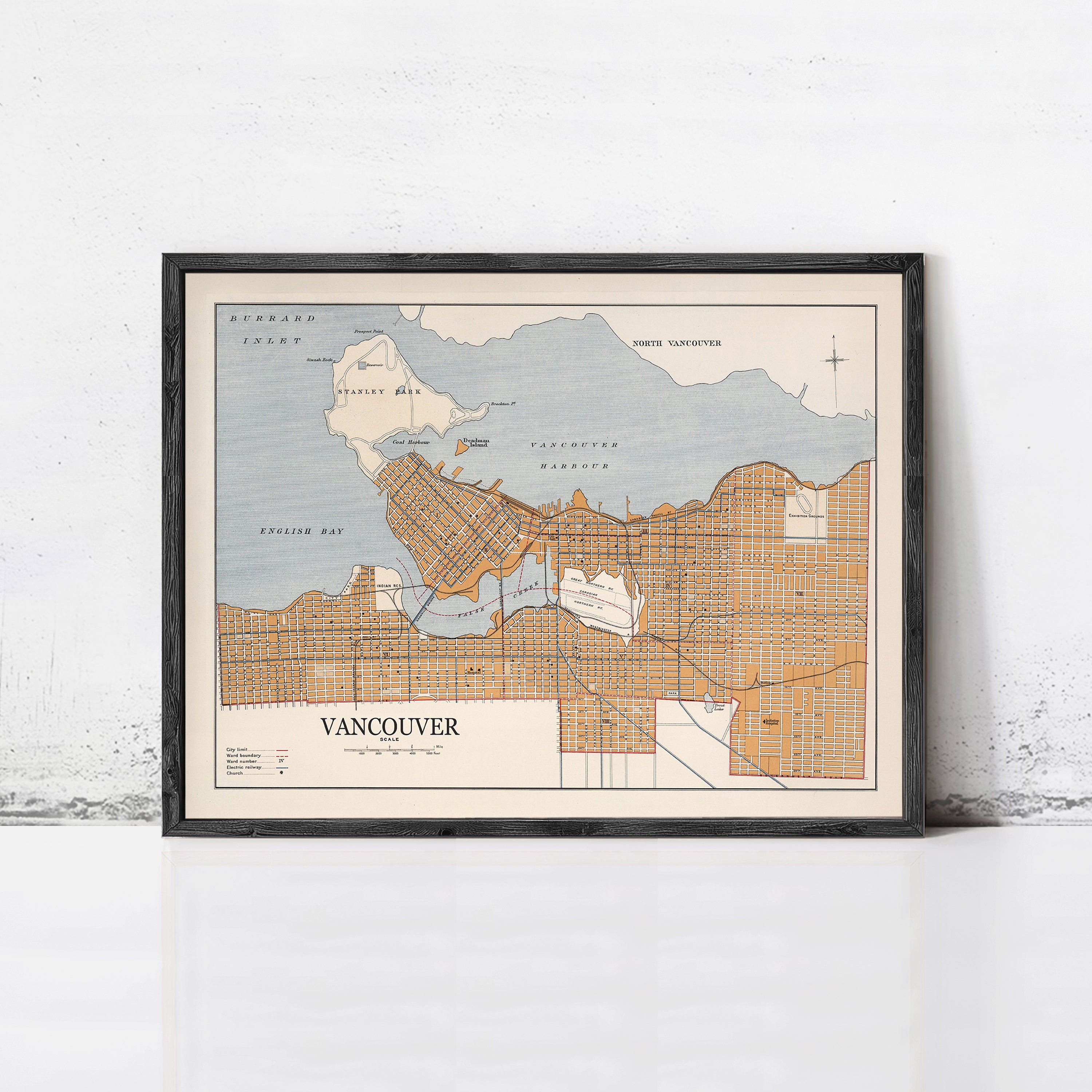 The image is a framed map of Vancouver, Canada, depicting the city's streets and surrounding areas.