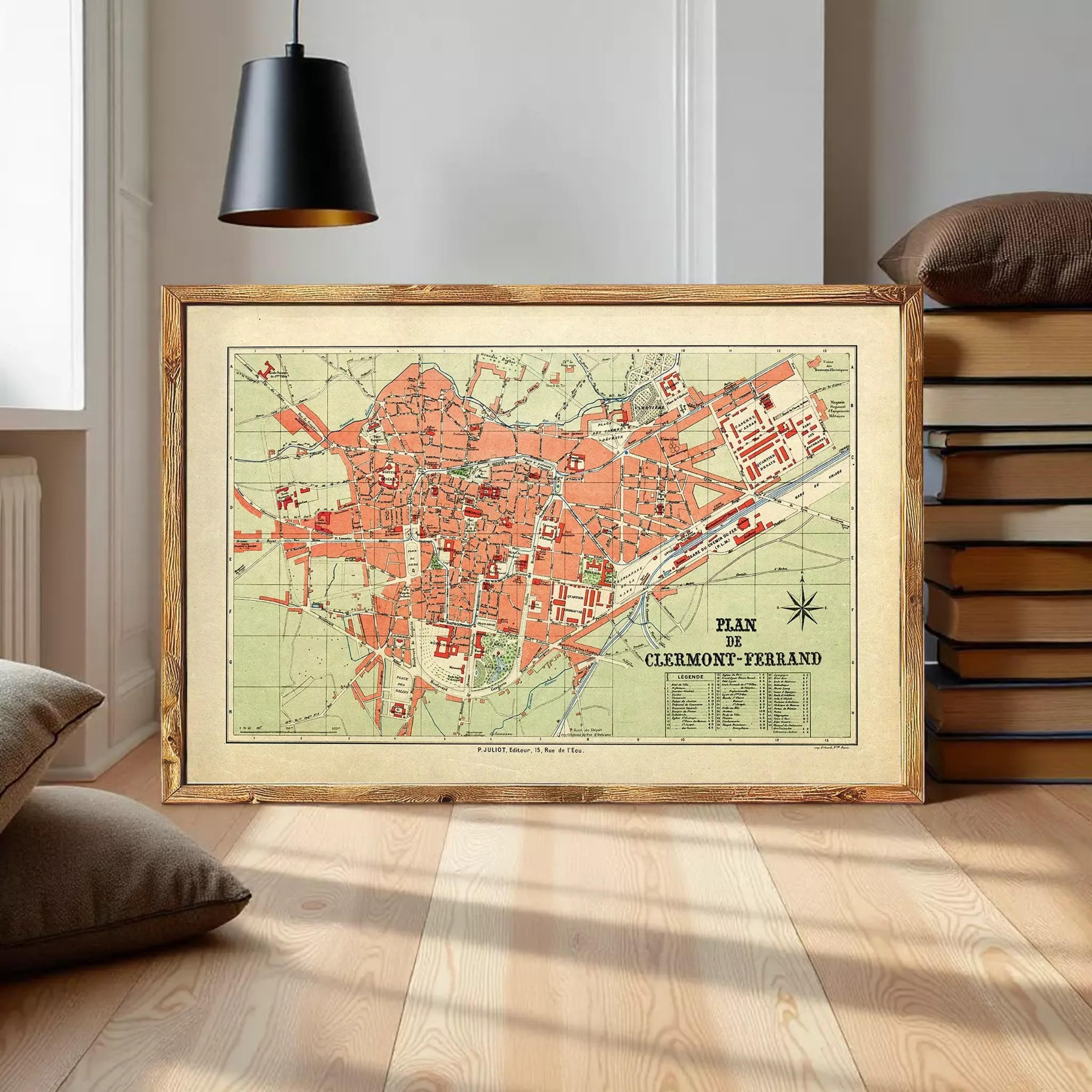 The image is a framed vintage map of Clermont-Ferrand, France, depicting the city's layout and surrounding areas.