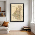 a large framed map of Belgium hanging on a wall in a living room.