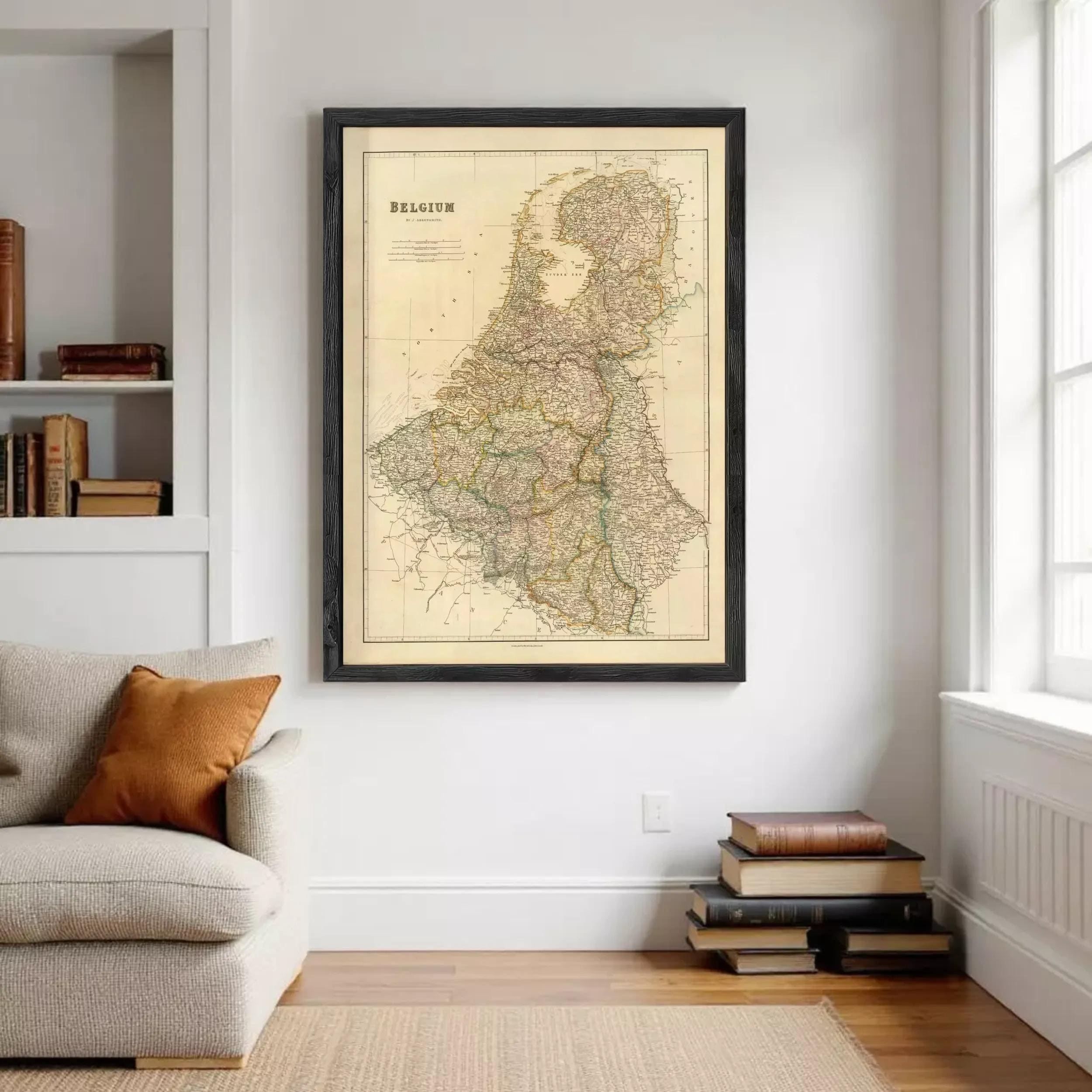 a large framed map of Belgium hanging on a wall in a living room.