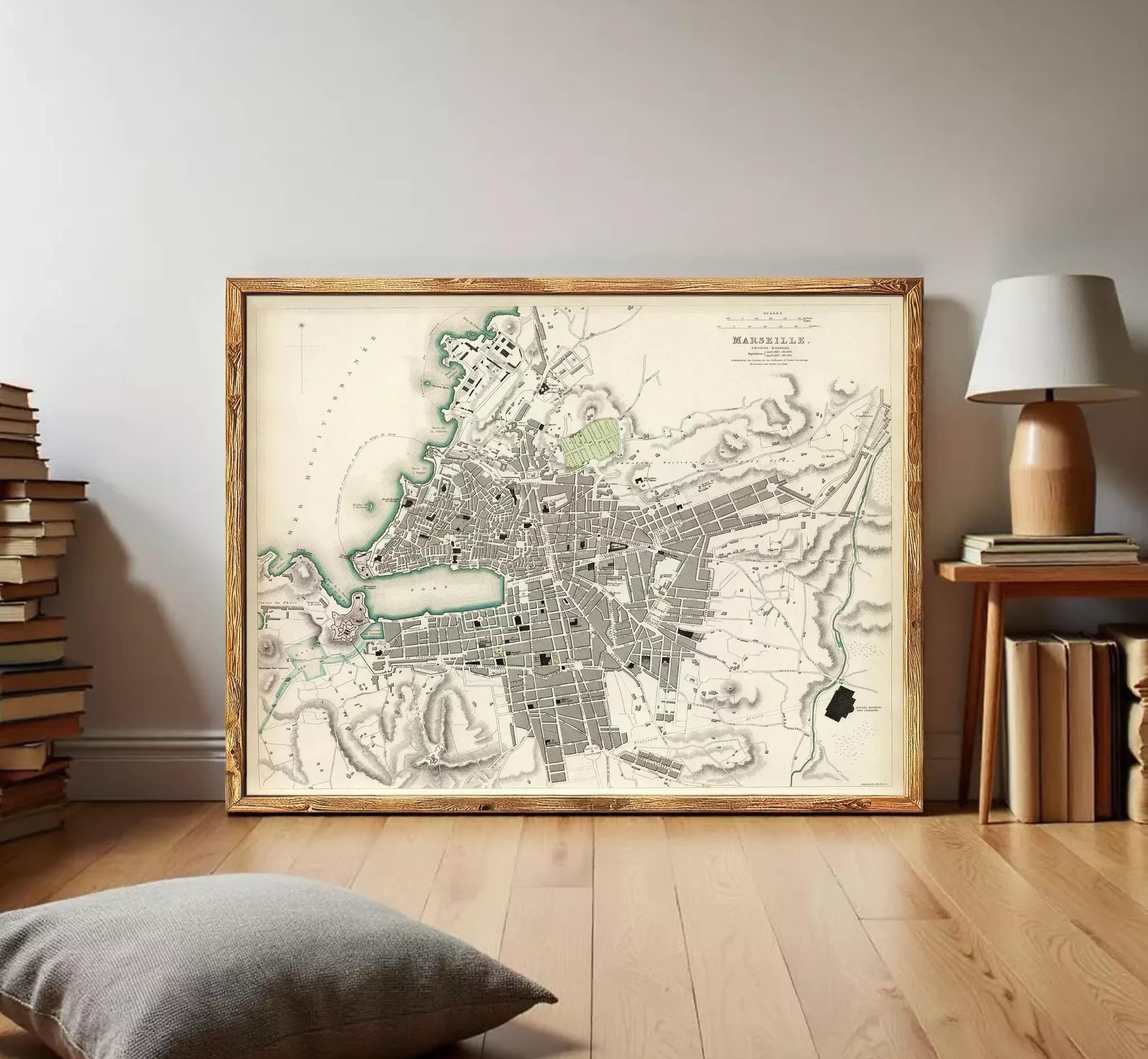 The image is a framed historical map of a city, likely from the 19th century, depicting the layout and geographical features of the area.