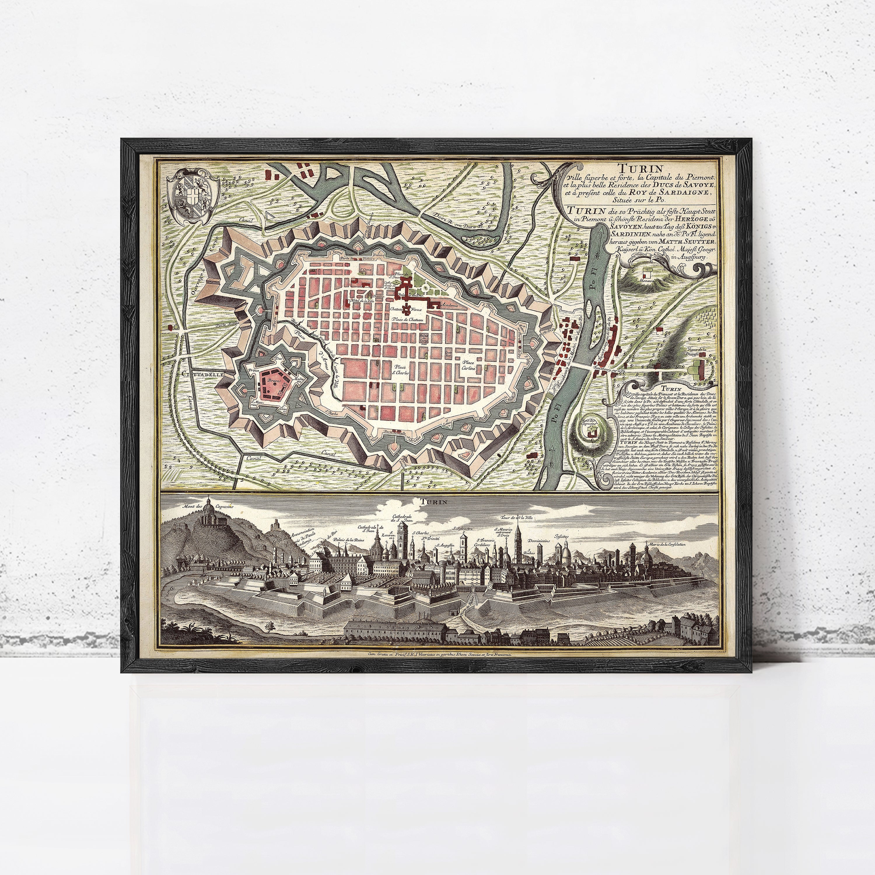 The image is a framed vintage map of Turin, Italy, depicting the city's layout and surrounding areas.