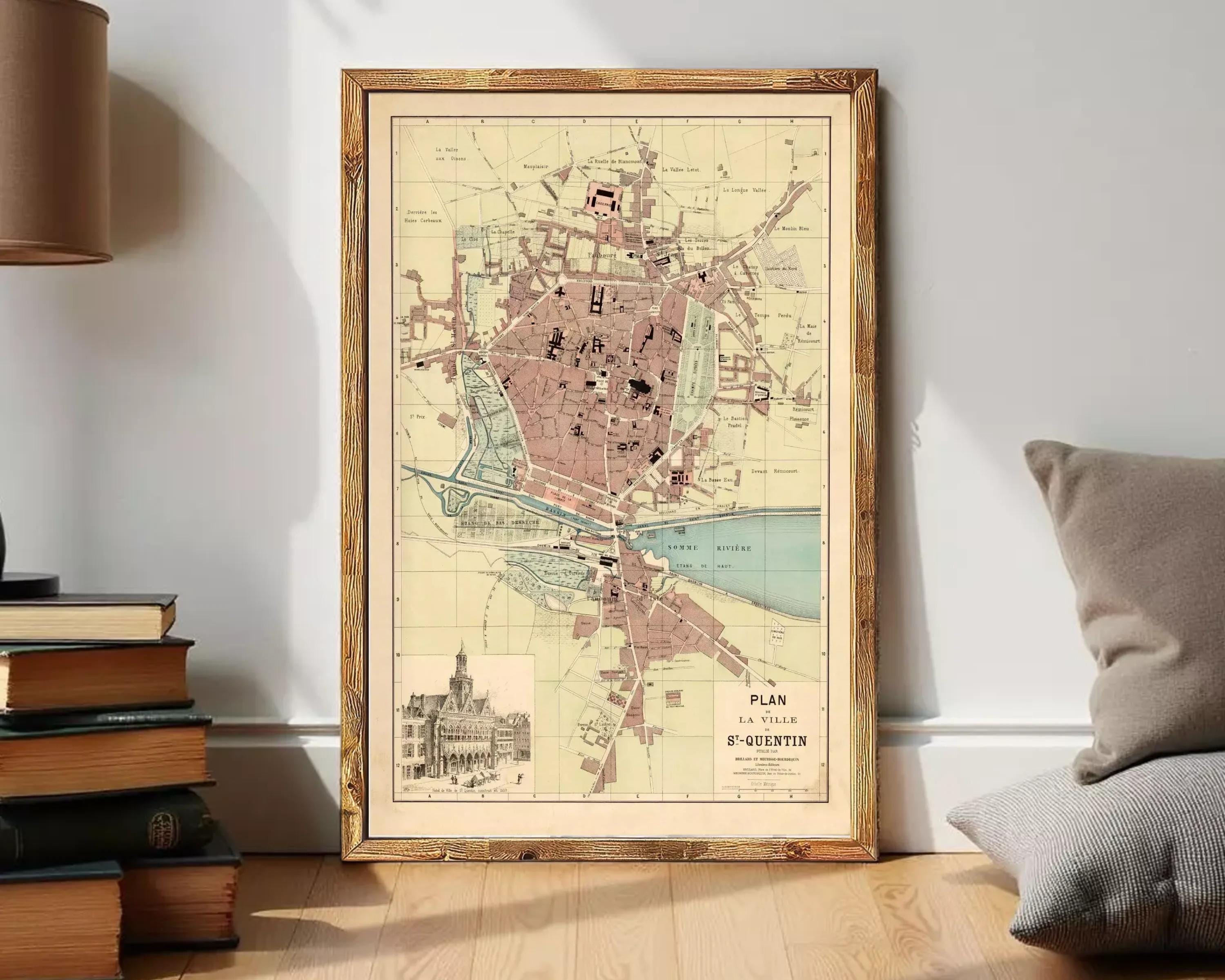 The image is a framed vintage map of a city, depicting a detailed layout of streets, buildings, and other landmarks.
