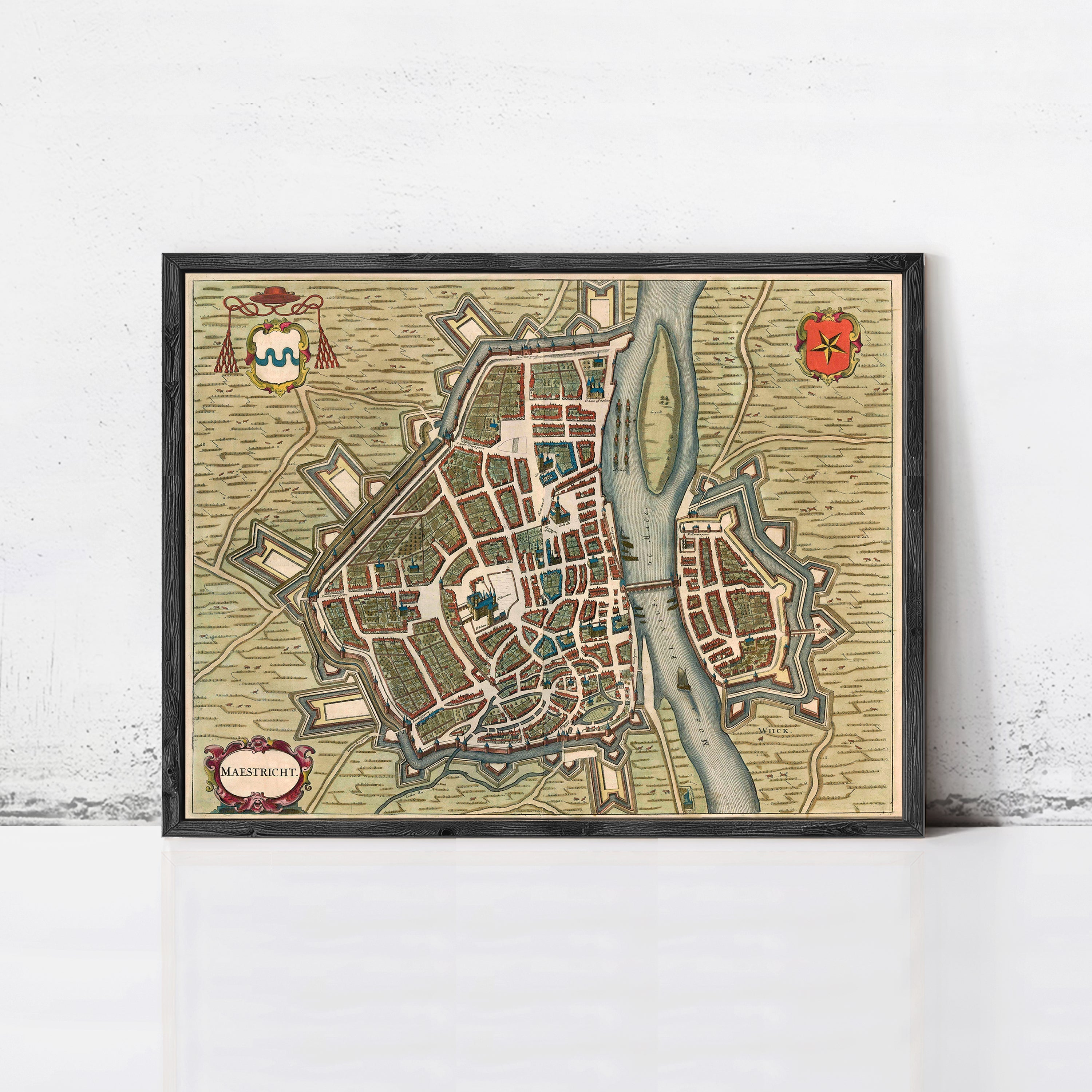 The image is a framed vintage map of a city, likely from the 16th century, depicting a detailed layout of the city with streets, buildings, and other landmarks.