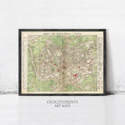 The image is a framed vintage map of London, England, with a black border and a green and red color scheme.