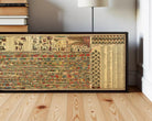 a large, colorful, and detailed map of the world displayed on a wooden floor.