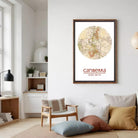 a living room with a large framed map of Australia hanging on the wall, a wooden chair, a bookshelf, and a lamp.