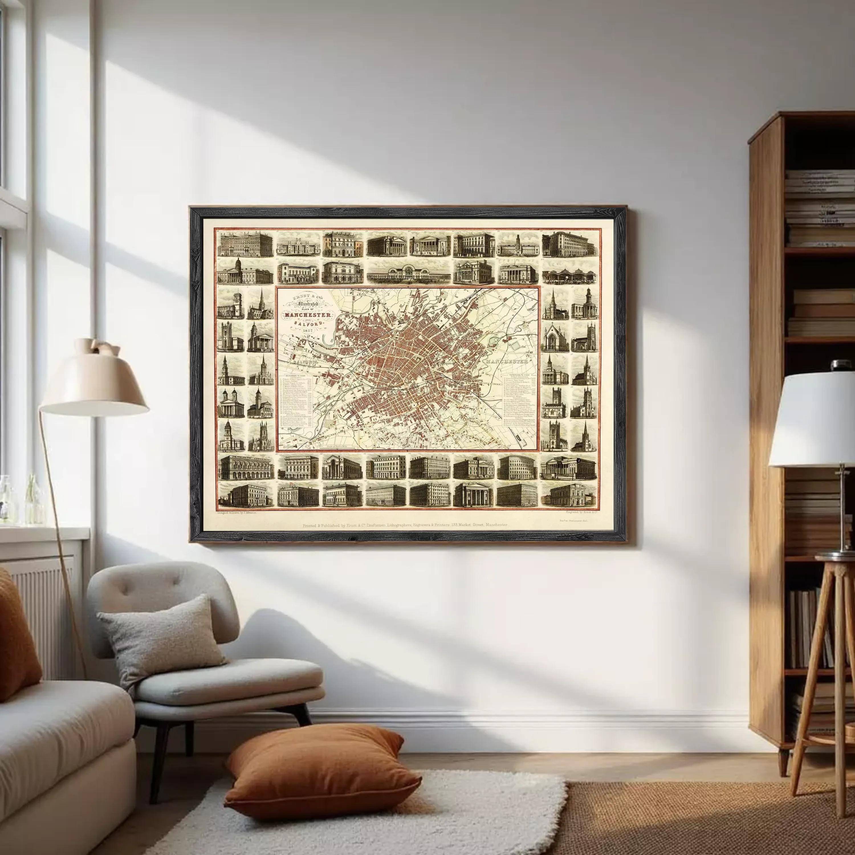 The image is a framed vintage map of Manchester, London, England, depicting various buildings and landmarks within the city.