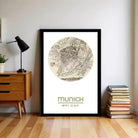 a framed map of Munich, Germany, with the text "München" written below it.