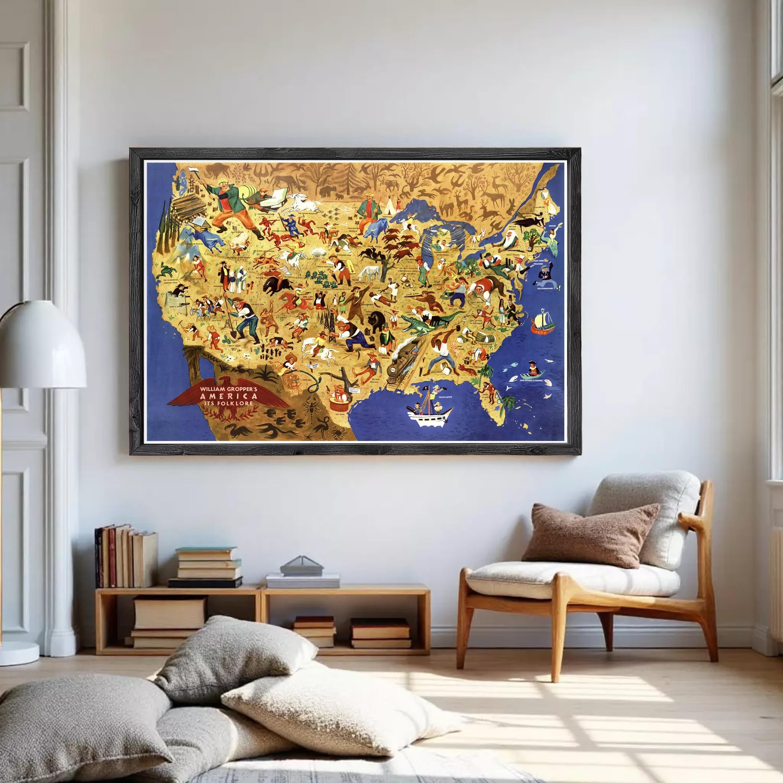 The image is a framed poster depicting a colorful and detailed map of the United States, with various landmarks, symbols, and people represented across the different regions.
