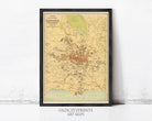 The image is a framed vintage map of the city of Paris, France, depicting the city's streets, landmarks, and surrounding areas.