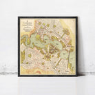 The image is a framed vintage map of a city, depicting various landmarks and streets.
