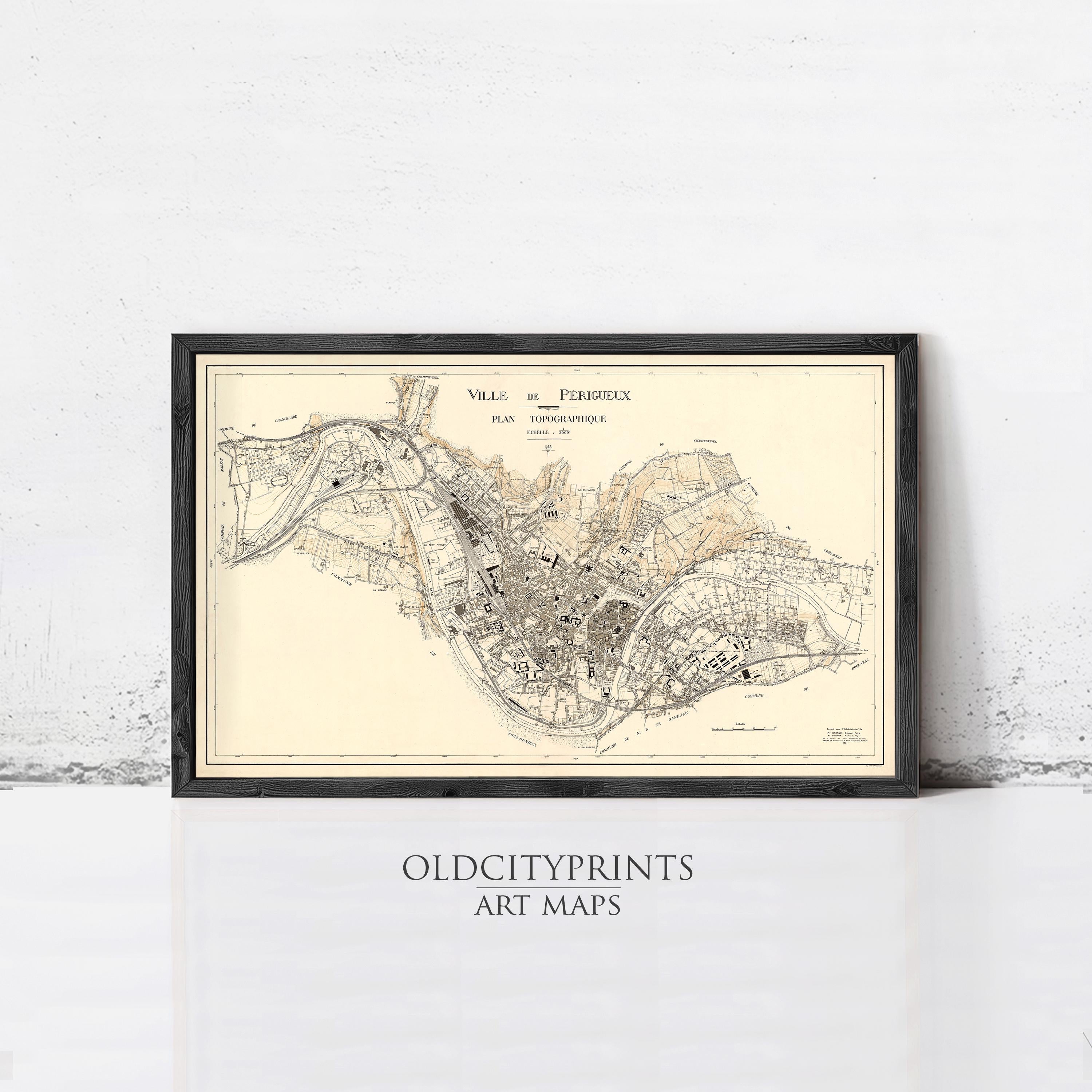 The image is a framed vintage map of a city, depicting the layout and streets of the area.