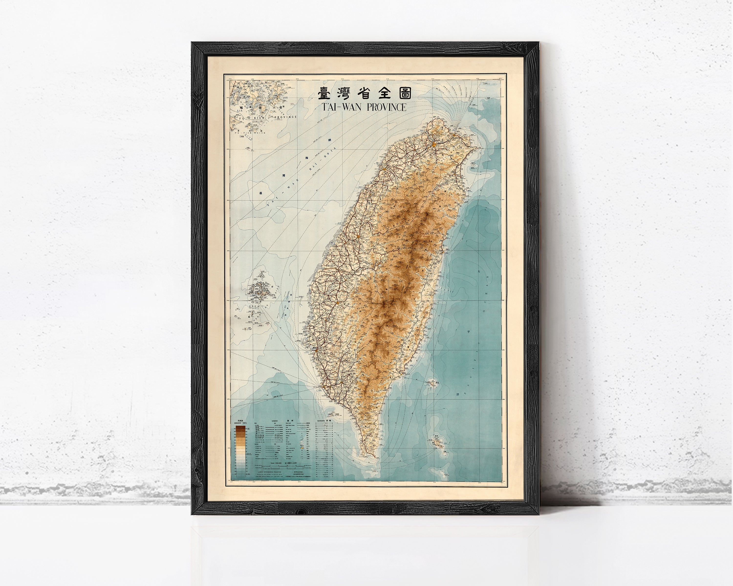 The image is a framed map of Taiwan, with a vintage style and a color palette of blue, green, and brown.