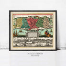 The image is a framed vintage map depicting a city with ships and boats in the foreground, and a mountainous landscape in the background.
