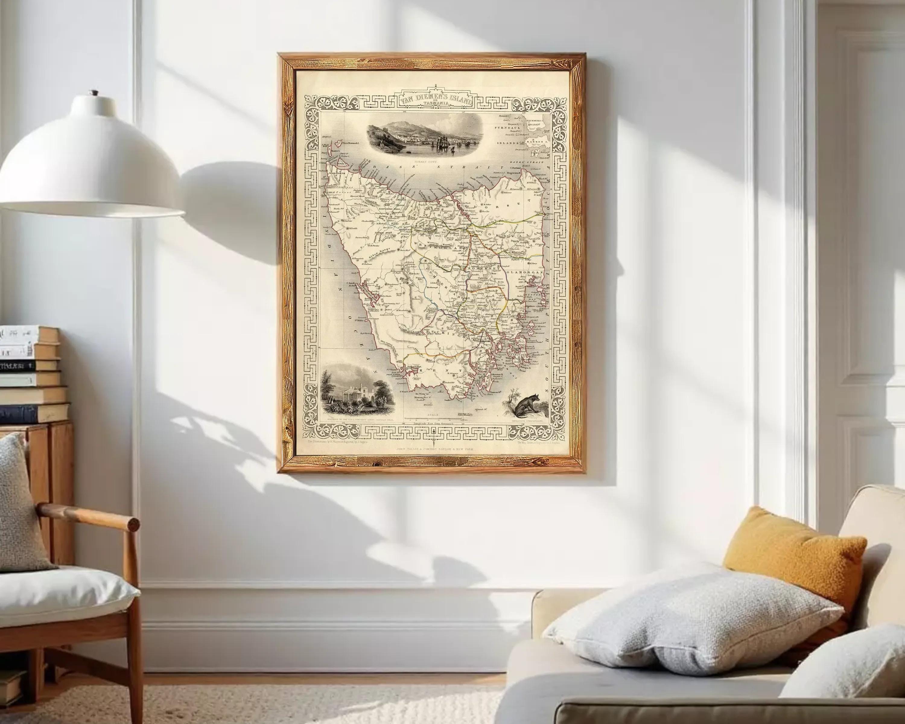 The image is a framed vintage map of the State of Victoria, Australia, with various illustrations and details surrounding the map.