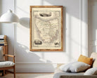 The image is a framed vintage map of the State of Victoria, Australia, with various illustrations and details surrounding the map.