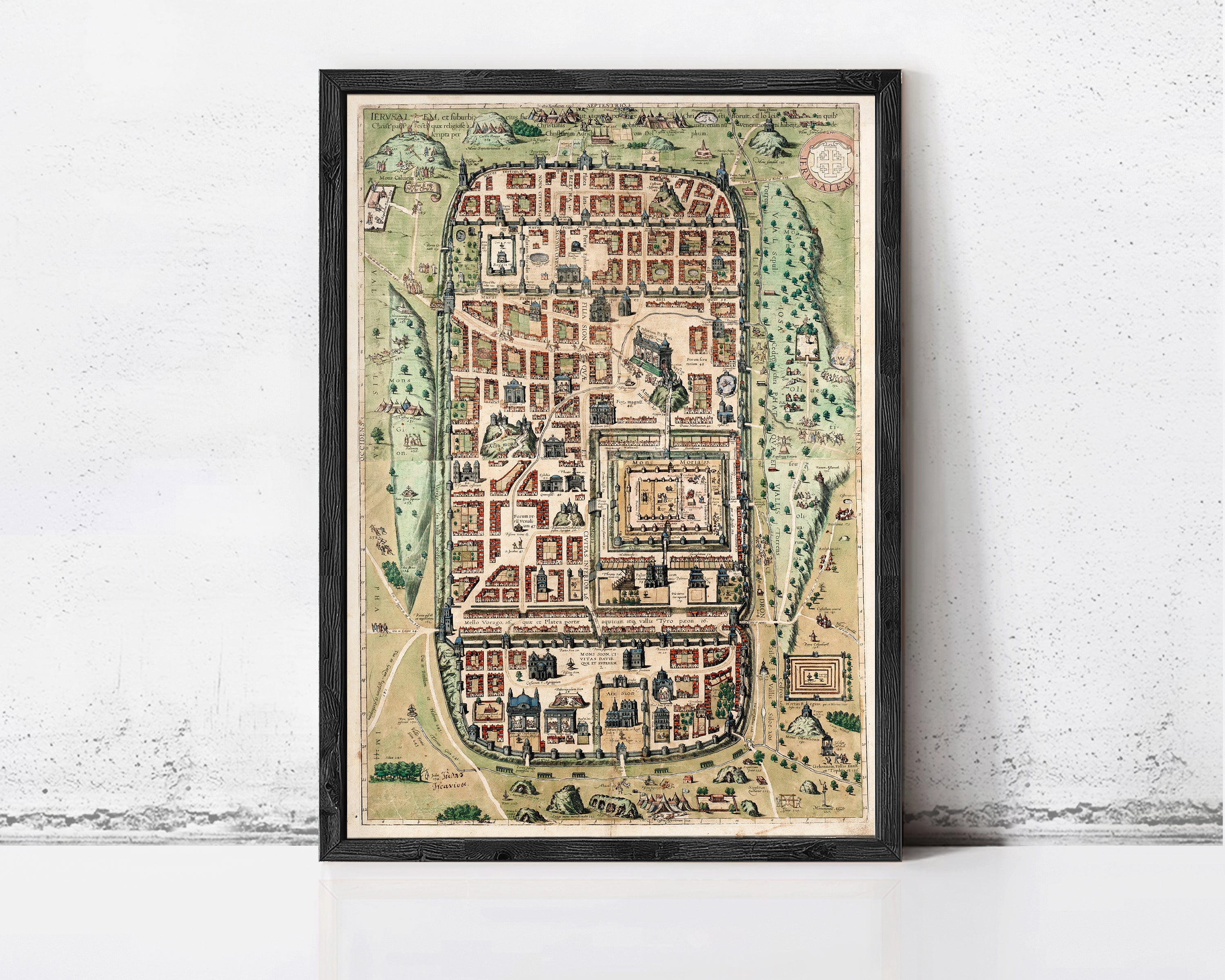 The image is a framed map of a city, depicting various buildings, roads, and other urban elements.