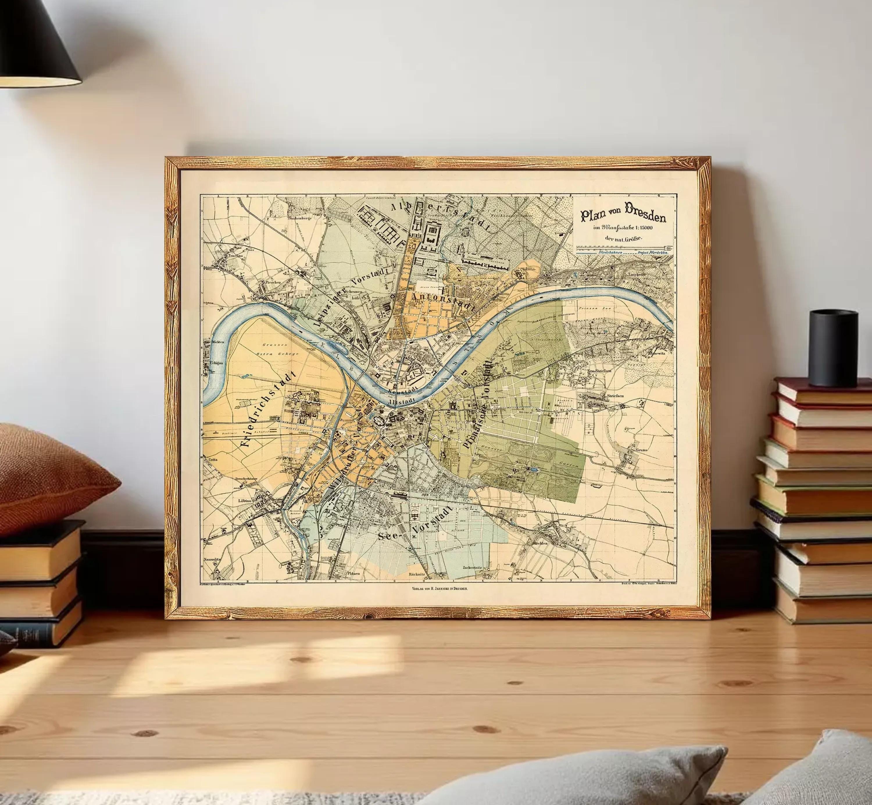 The image is a framed vintage map of a city, likely from the 19th century, depicting various landmarks and geographical features.