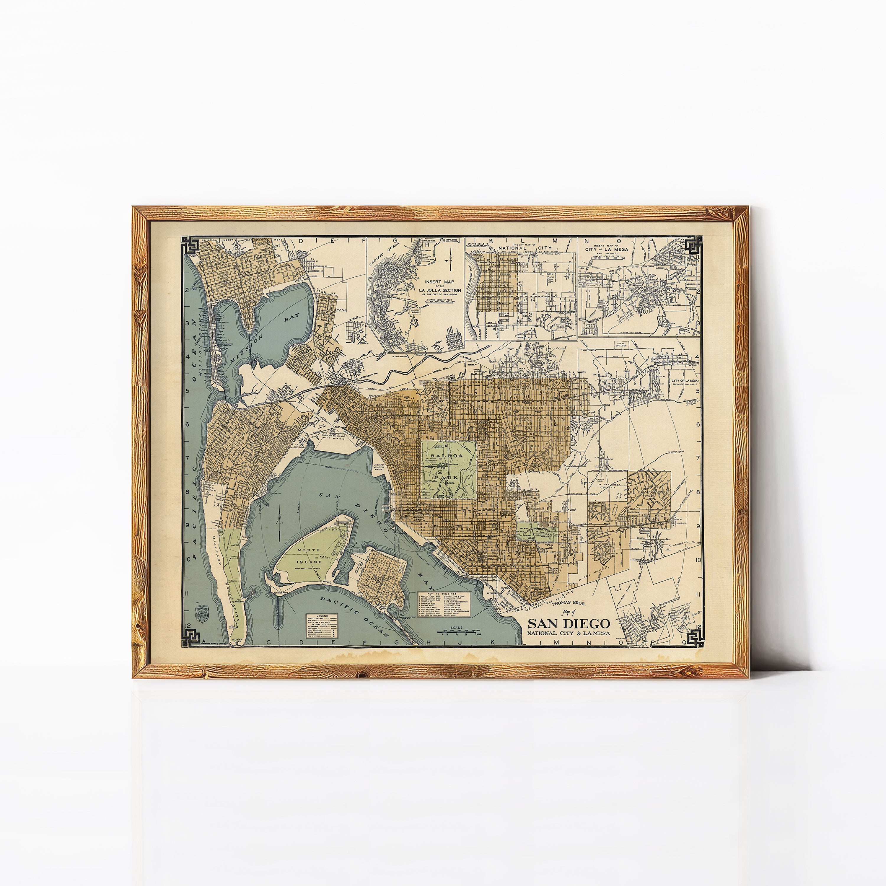 The image is a framed vintage map of San Diego, California, depicting the city's layout and surrounding areas.