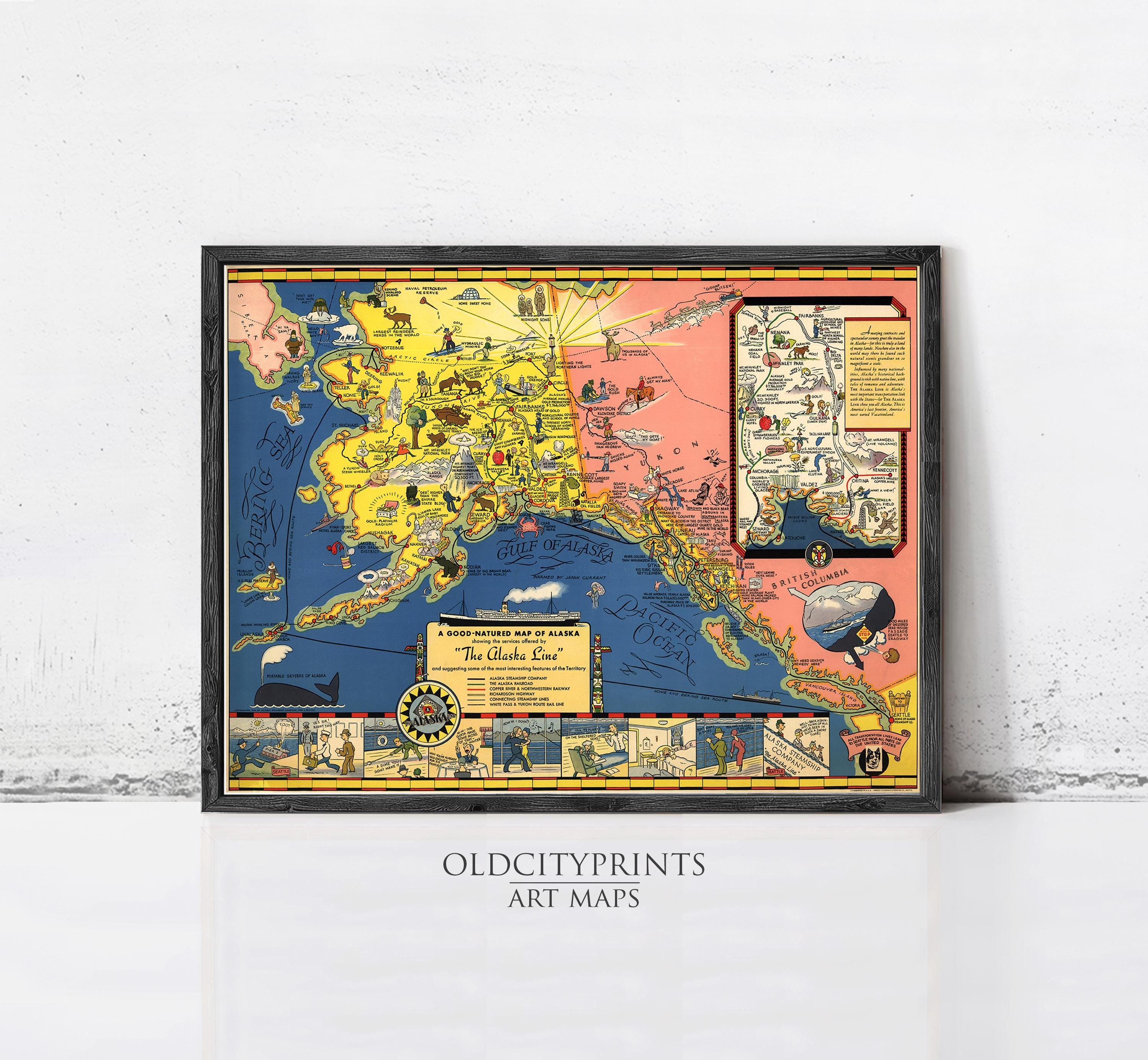 The image is a framed vintage map of Alaska, featuring colorful illustrations and labels.