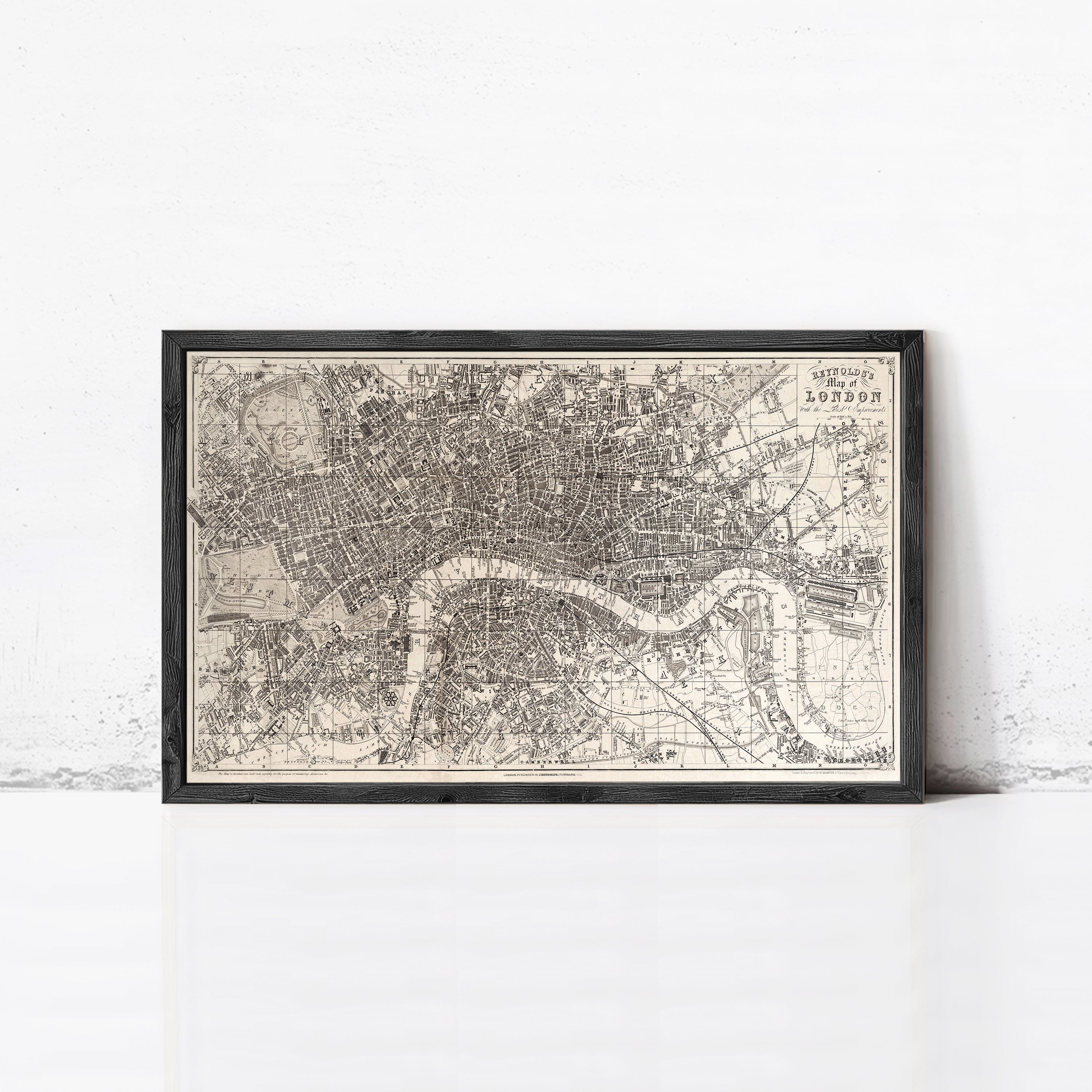 The image is a framed vintage map of London, England, depicting the city's streets and landmarks.