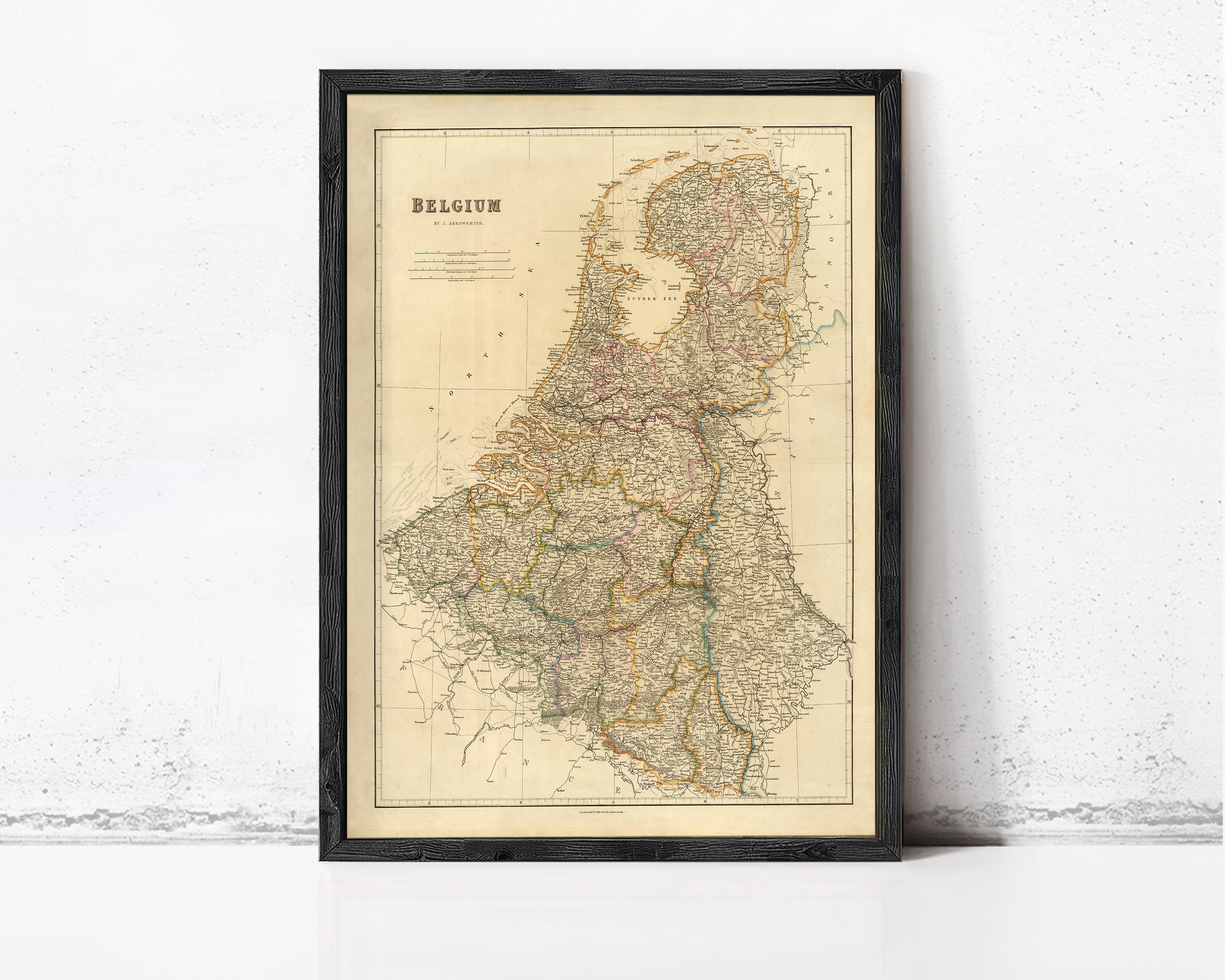 The image is a framed map of Belgium, showing the country's geographical layout and surrounding areas.