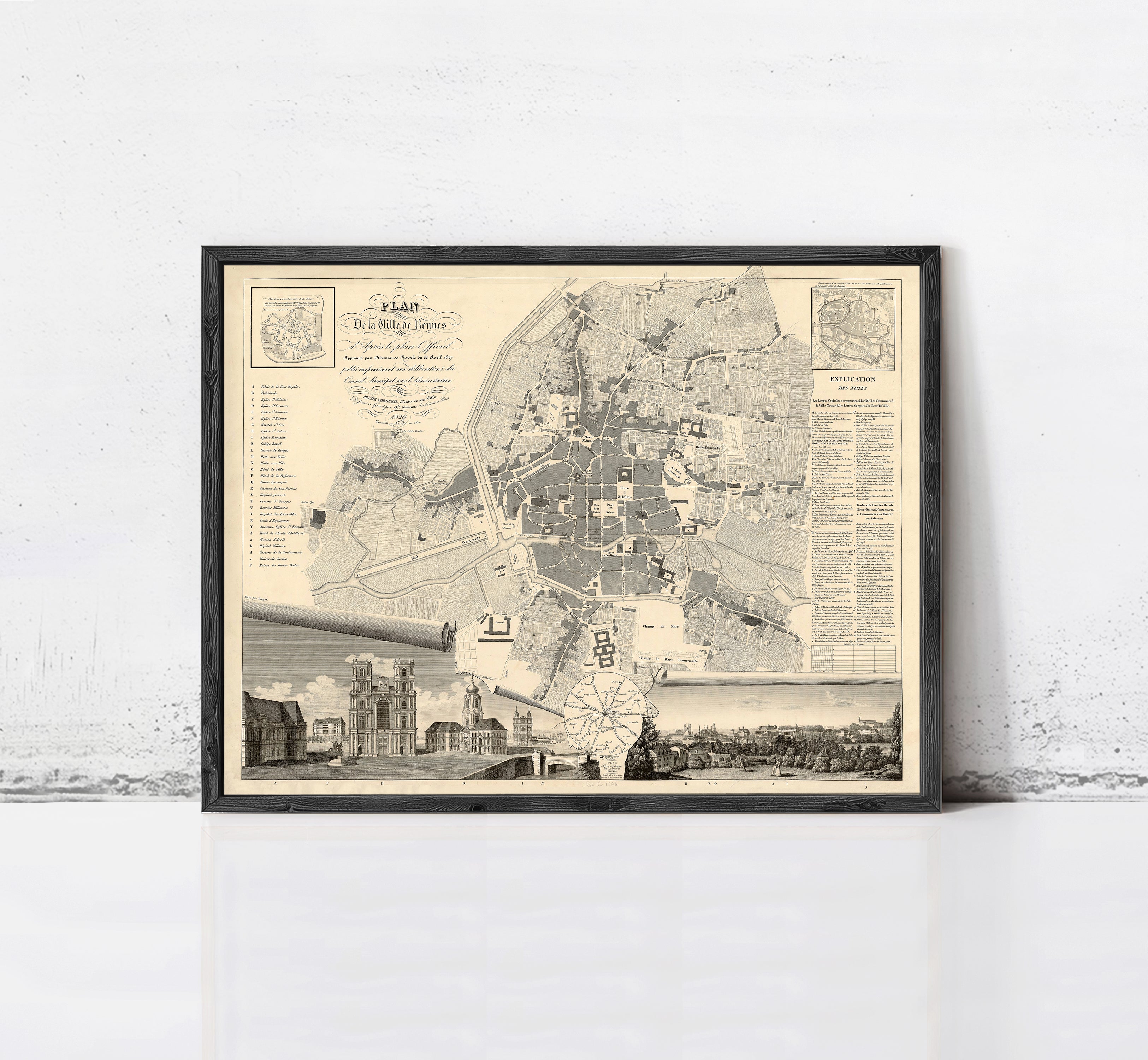 The image is a framed vintage map of a city, depicting various landmarks and streets.