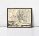 The image is a framed vintage map of a city, depicting various landmarks and streets.