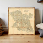 The image is a framed map of the city of Pompeii, Italy, depicting the layout and layout of the city in a detailed and historical manner.