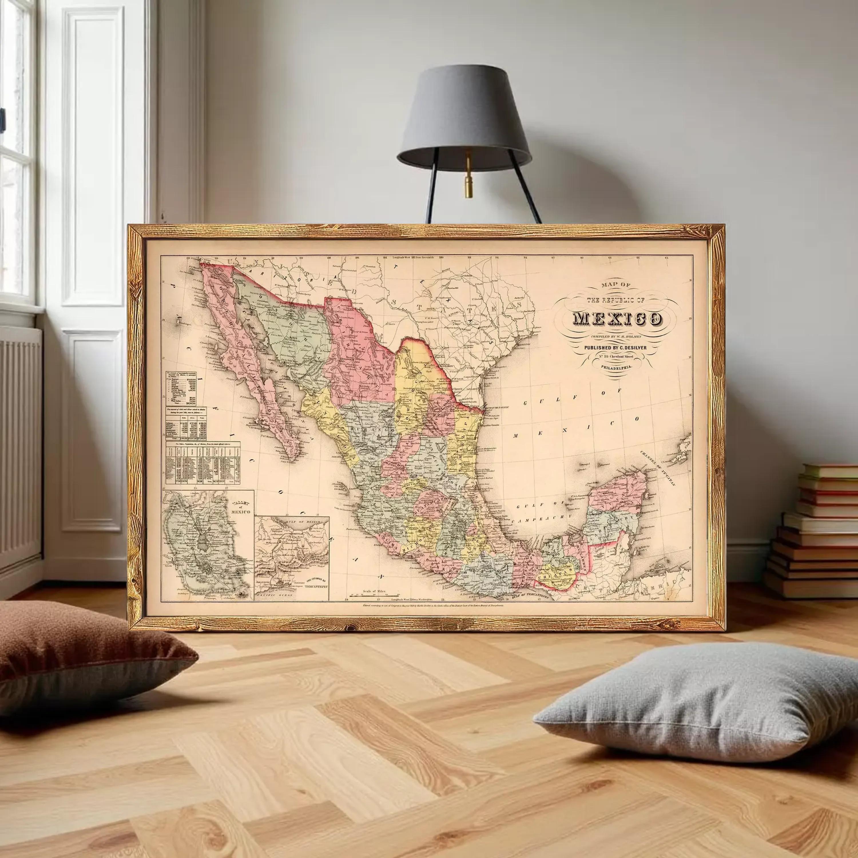 a large framed map of Mexico, with a lamp and some books in the background.
