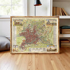 A framed map of Rome, depicting the city's ancient and modern areas, with various landmarks and locations marked.