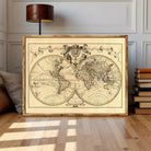 The image is a framed antique world map depicting the continents and oceans of the known world.
